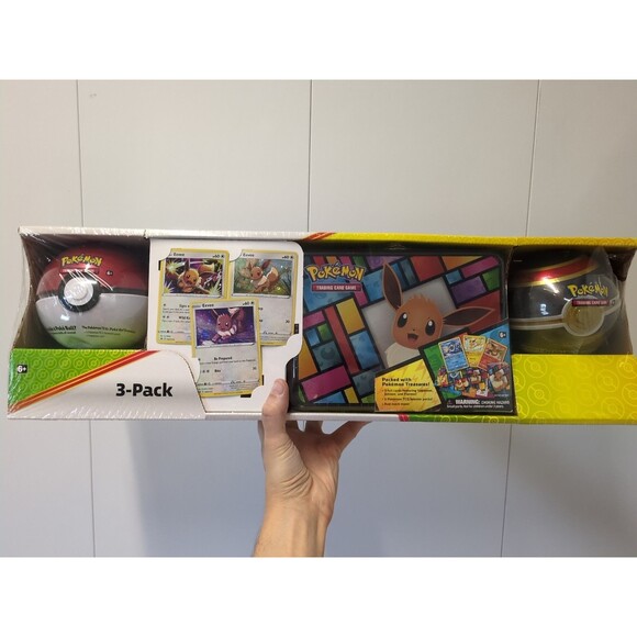 Pokemon Eevee Evolutions 3-Pack Treasure Chest Tin & 2 PokeBalls - Costco